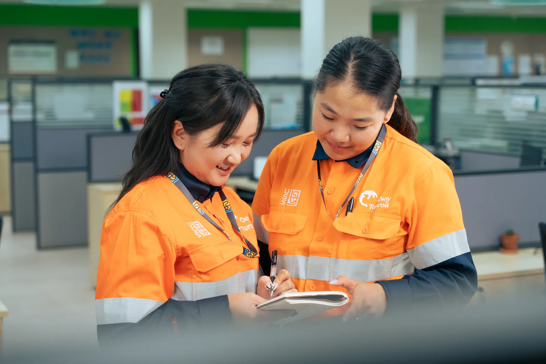 Uniservice Solution team members reviewing notes